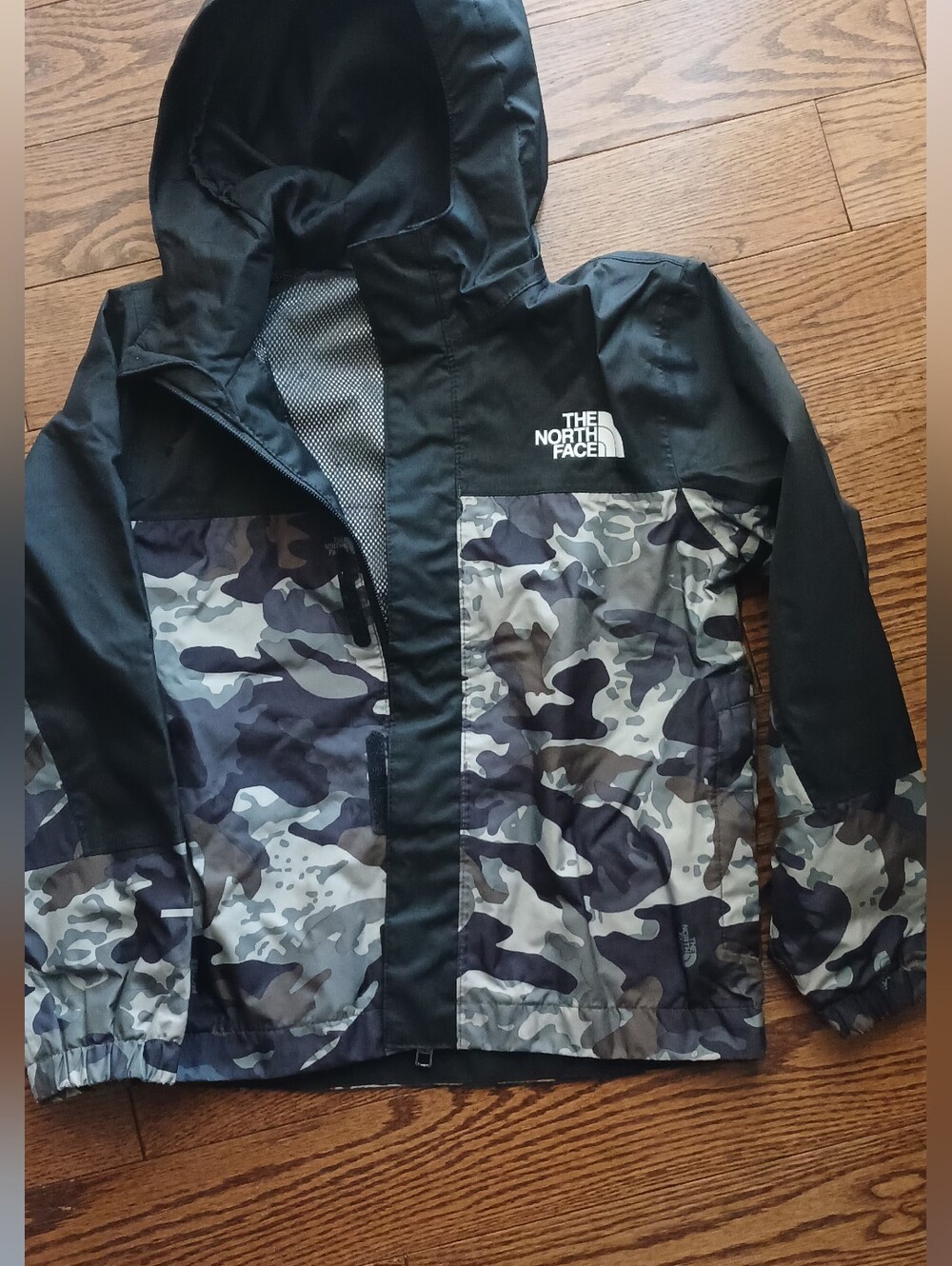 The North Face Kids Black and Gray Camo Raincoat with Hood
